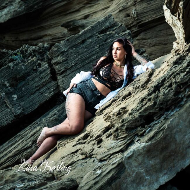 Woman lying at the beach in a sexy photo